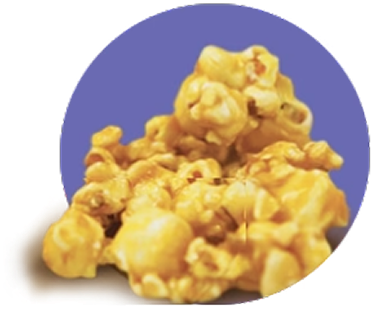 Sweet caramel popcorn against purple background