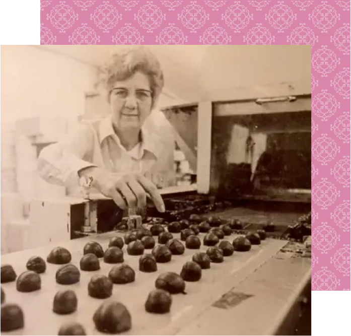 Person making handmade chocolates in a kitchen
