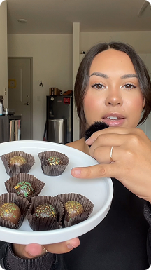 Woman holding plate of dubai chocolate truffles