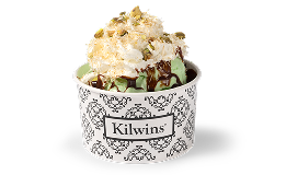 Milk chocolate dubai truffle sundae with pistachio ice cream, chocolate syrup, whipped cream and nuts