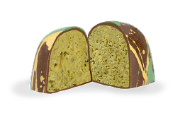 Milk chocolate dubai chocolate cut in half to show the kataifi and signature pistachio filling