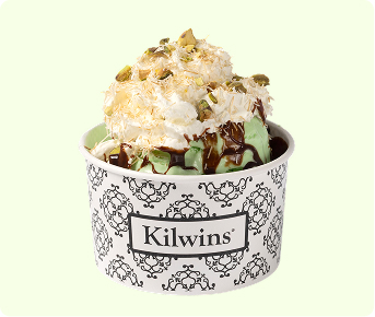 Ice cream sundae with whipped cream and nuts.